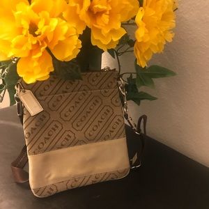 SIGNATURE COATED CANVAS CROSSBODY